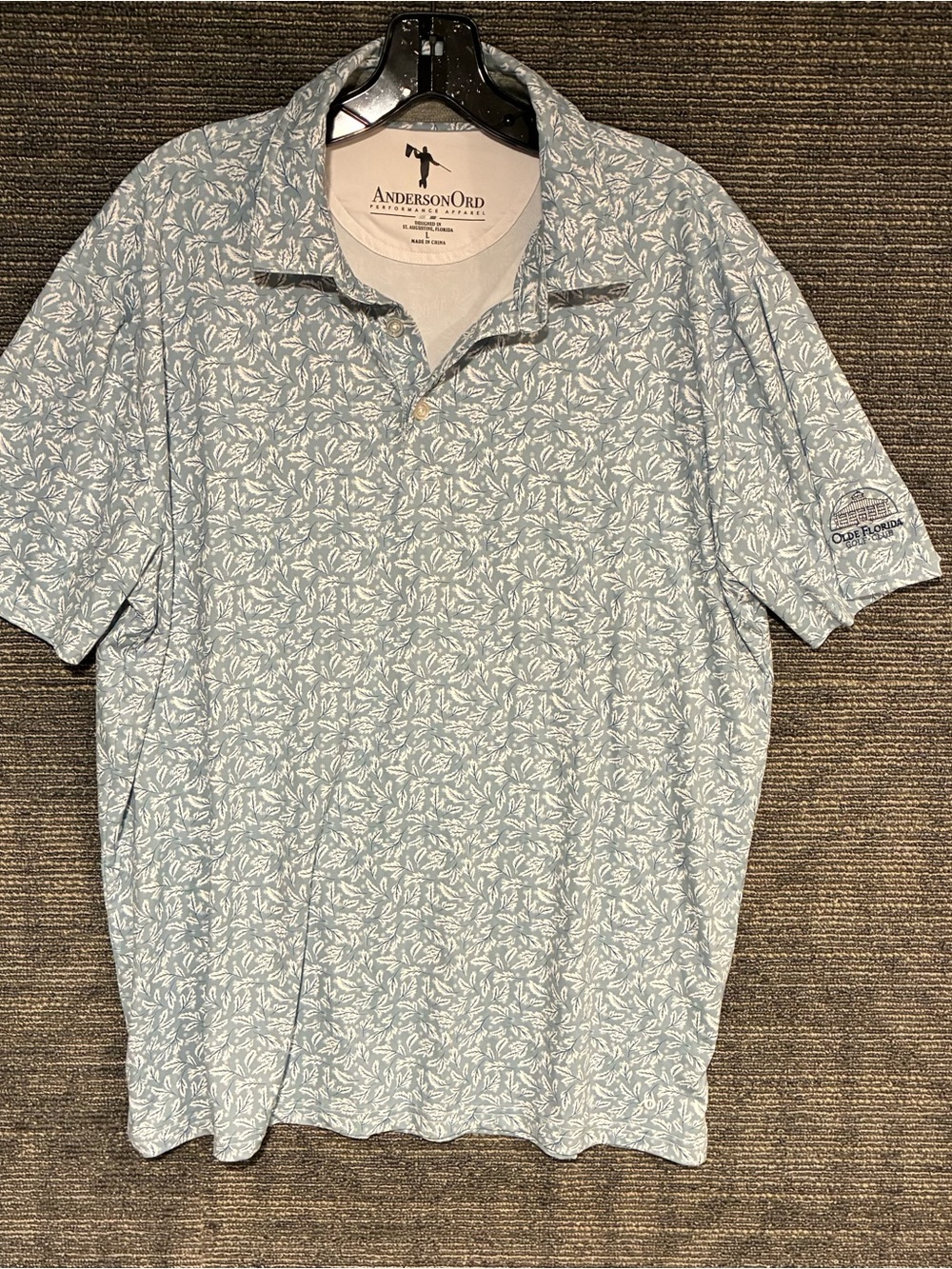 AndersonOrd Men's Pale Blue Floral Performance Polo Shirt from esteemed Olde Clu